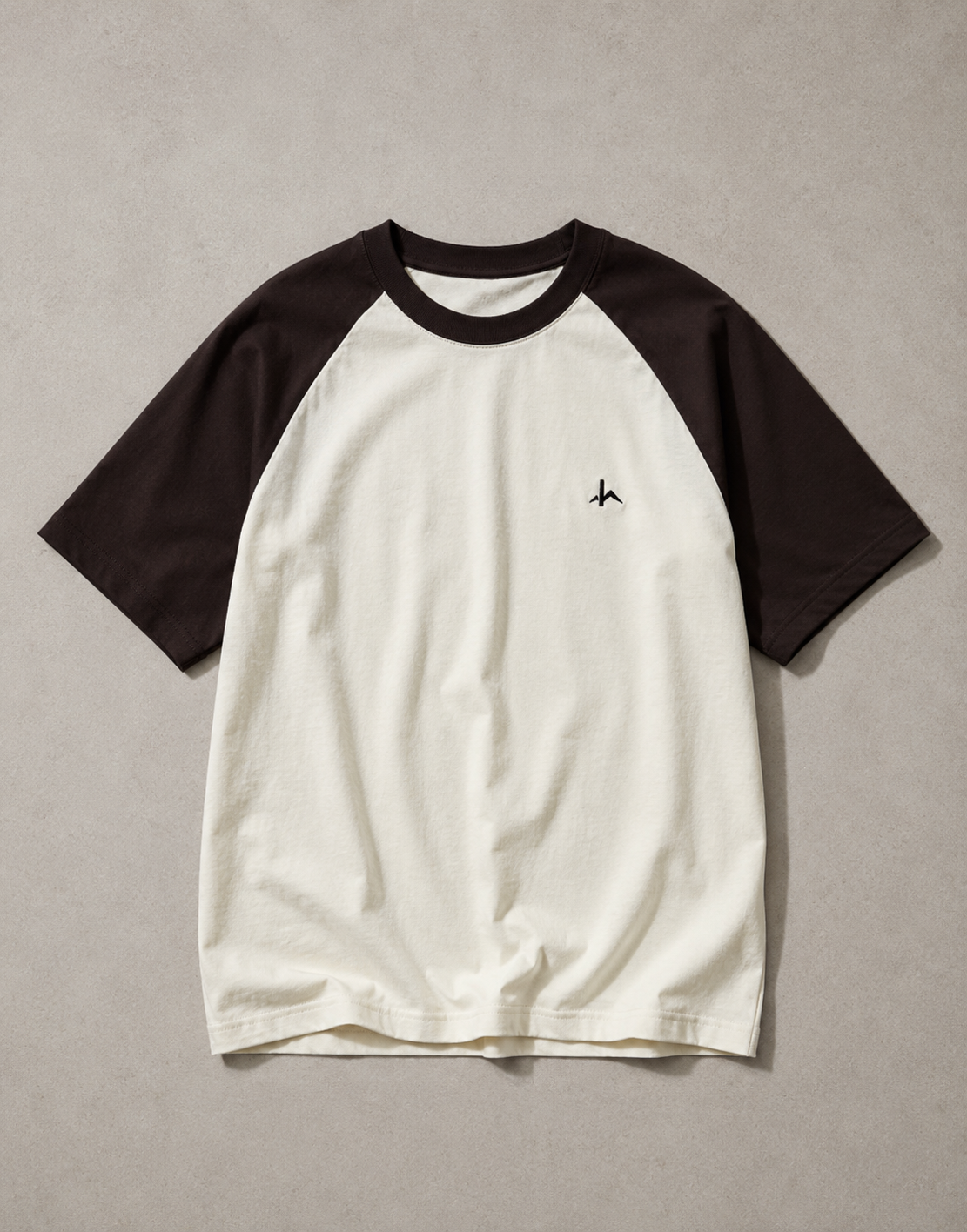 HideArc unisex oversized raglan shirt featuring a black and white color block design, casual fit, and long sleeves.